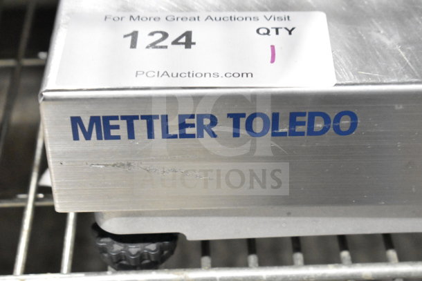 Mettler Toledo BC commercial food portioning scale, stainless steel, showing model tag and PCI Auctions label, in used condition.