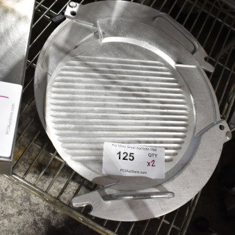 Two metal meat slicer components with ridged surfaces, auction tag "125, QTY x2" from PCIAuctions.com.