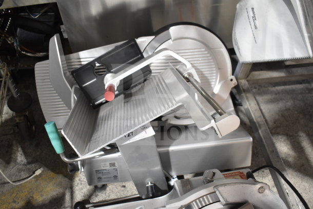 2018 Bizerba GSP H commercial meat slicer, silver, 120V, 1 phase. Features adjustable blade and safety guard. Appears in good condition.