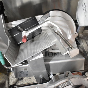 2018 Bizerba GSP H commercial meat slicer, silver, 120V, 1 phase. Features adjustable blade and safety guard. Appears in good condition.