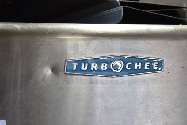 Turbochef HhC2020 commercial electric conveyor rapid cook oven detail, featuring brand logo on metal surface.