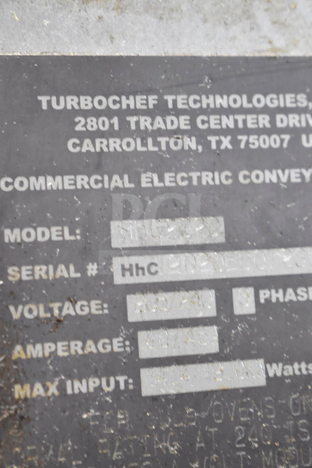 Turbochef HhC2020 conveyor oven label showing model, serial, voltage 208/240V, 3 phase, and location details.
