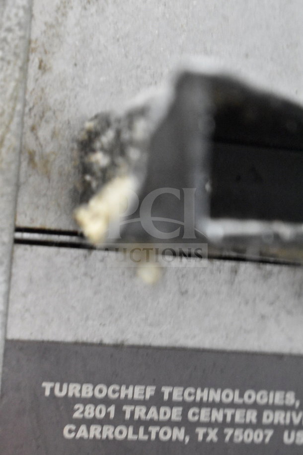 Turbochef HhC2020 rapid cook oven, visible plaque shows manufacturer details for model and location.