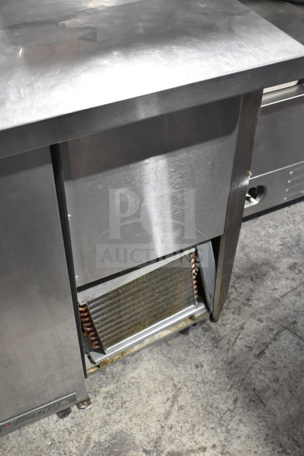 True TPP-67 Commercial Pizza Prep Table, stainless steel, 115 volts, 1 phase, visible compressor unit, used condition.