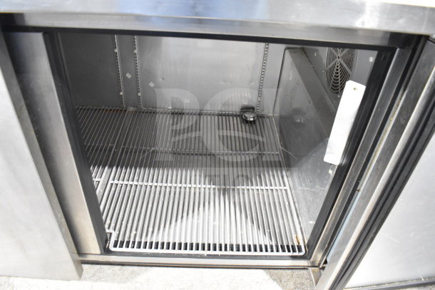True TPP-67 commercial pizza prep table, open interior view, stainless steel, 115 Volts, 1 Phase, very good condition.