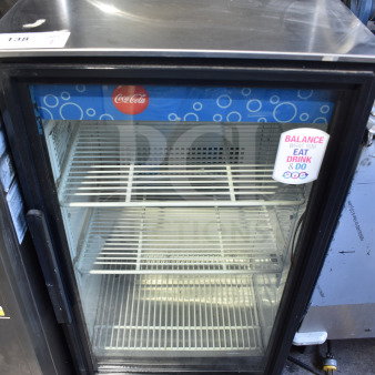 True GDM-06-LD mini cooler merchandiser, 115V, 1 phase, with glass door, Coca-Cola branding, shelves, in good condition.