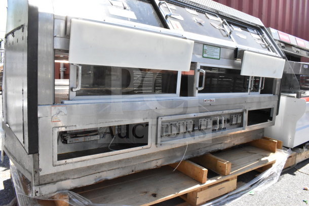 Commercial floor warming display case merchandiser, stainless steel, glass panels, visible control panel, used condition.