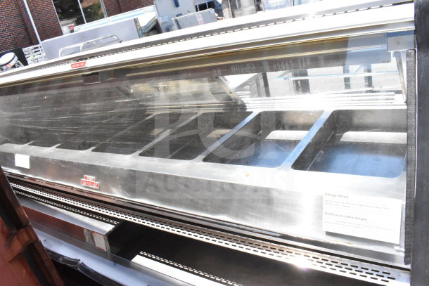 Commercial floor warming display case merchandiser, stainless steel, multiple compartments, caution hot label, allergy notice.