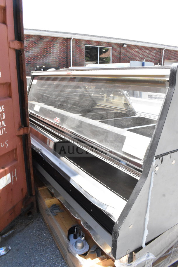 Commercial floor-style warming display case, glass front, metal frame, used condition, suitable for food merchandising.