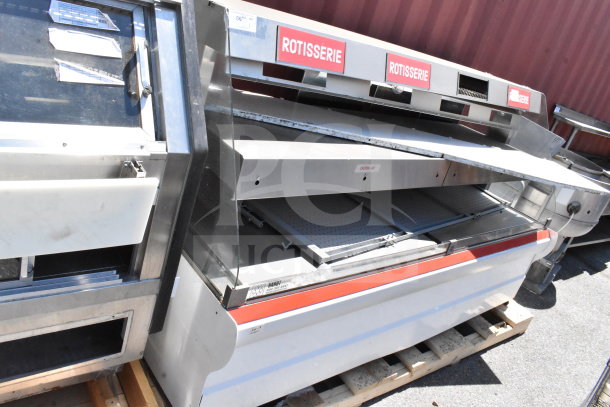Commercial 2-tier warming display case merchandiser, stainless steel, labeled "Rotisserie," used condition, on pallet.