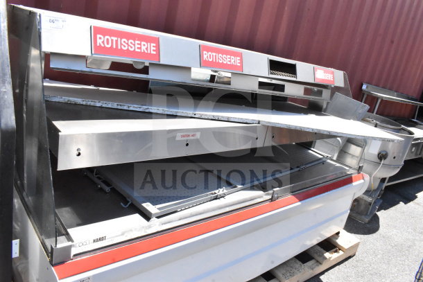 Commercial two-tier warming display case merchandiser, stainless steel, "Rotisserie" sign, visible wear, ideal for foodservice.