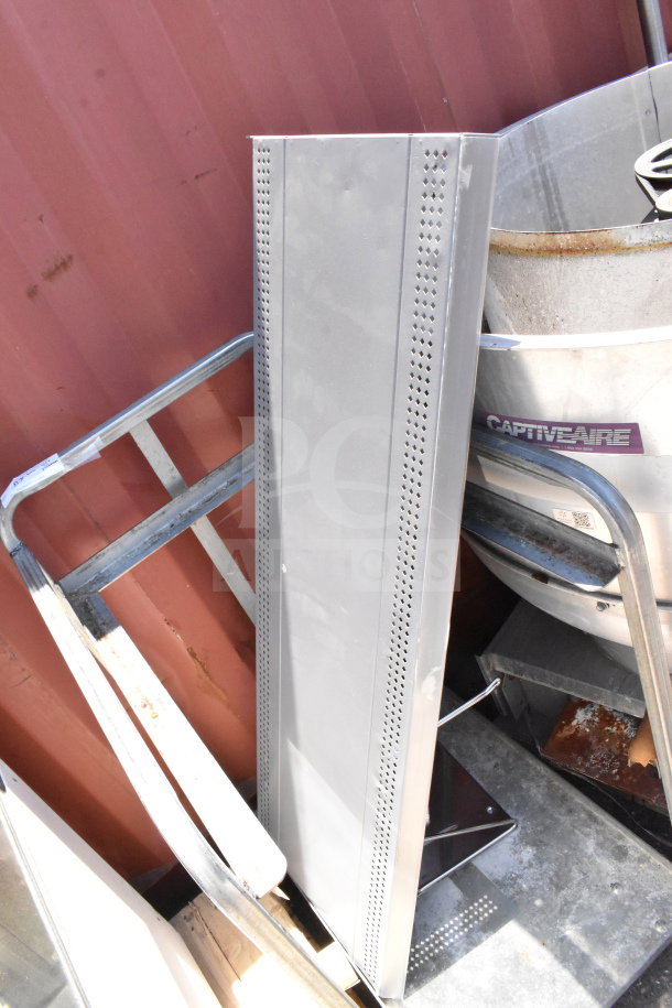 Commercial baking pan rack on casters, metal construction, visible wear, gray finish, suitable for professional kitchens.