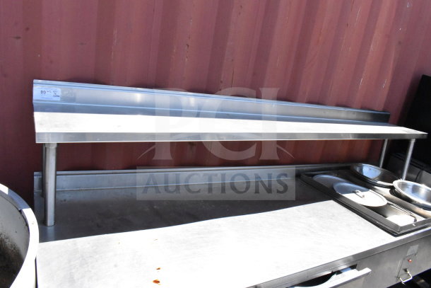 Commercial table with two drawers, overshelf, undershelf, and heated well. Stainless steel, good condition.