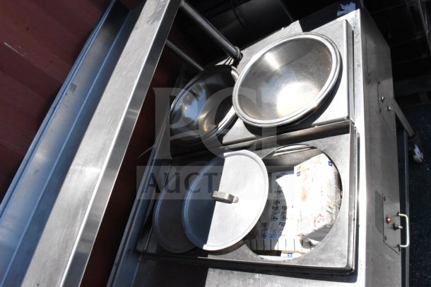 Commercial stainless steel table with two drawers, over shelf, under shelf, and heated well. Features bowl inserts and control panel.