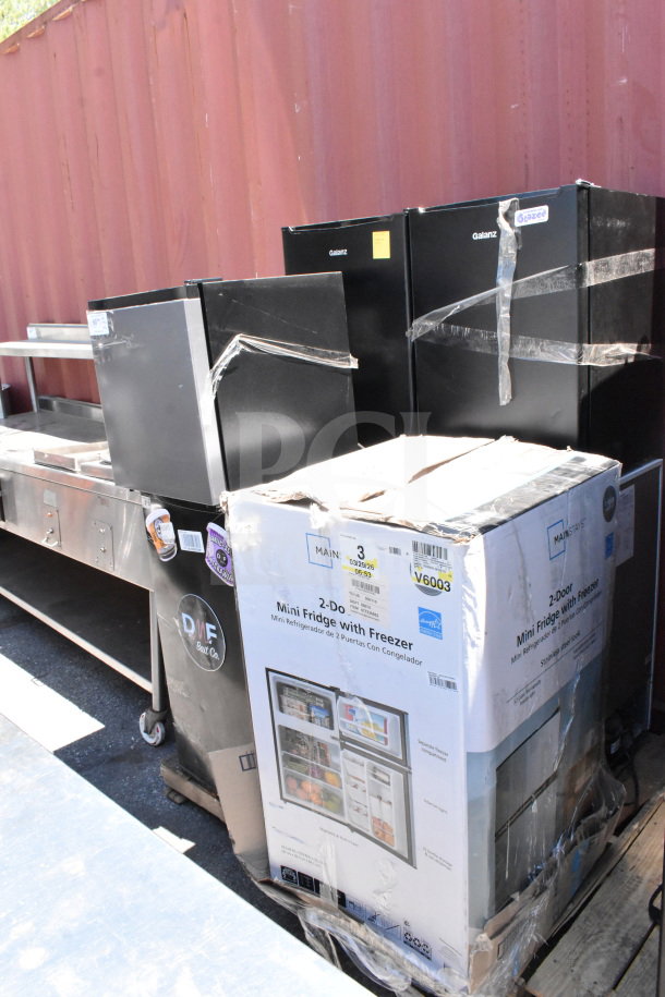 Seven mini coolers, including Galanz and Hisense models. 115 volts, 1 phase, packaged together. Visible brand tags and packaging.