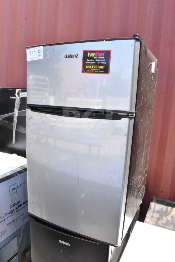 Six mini coolers including Galanz and Insignia brands, 115 volts, 1 phase. Features visible brand logos and tags.
