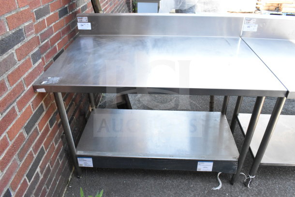 Winholt commercial table with backsplash, under shelf, stainless steel, light wear, tags indicating model and pricing.