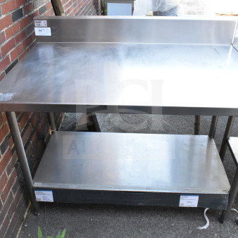 Winholt commercial table with backsplash, under shelf, stainless steel, light wear, tags indicating model and pricing.