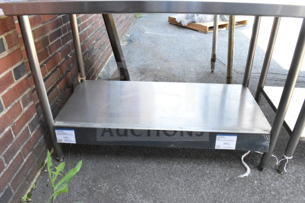 Winholt Commercial Table with back splash and lower shelf, stainless steel, good condition, suitable for kitchen use.