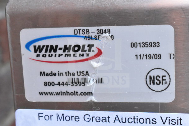 Winholt equipment tag on commercial table noting model DTSB-3048, made in USA. Features NSF certification.