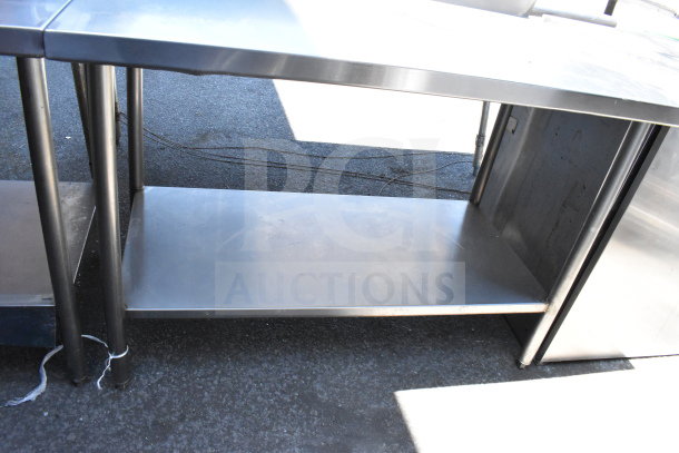 Winholt commercial stainless steel table with backsplash and undershelf; sturdy, ideal for kitchen use, good condition.