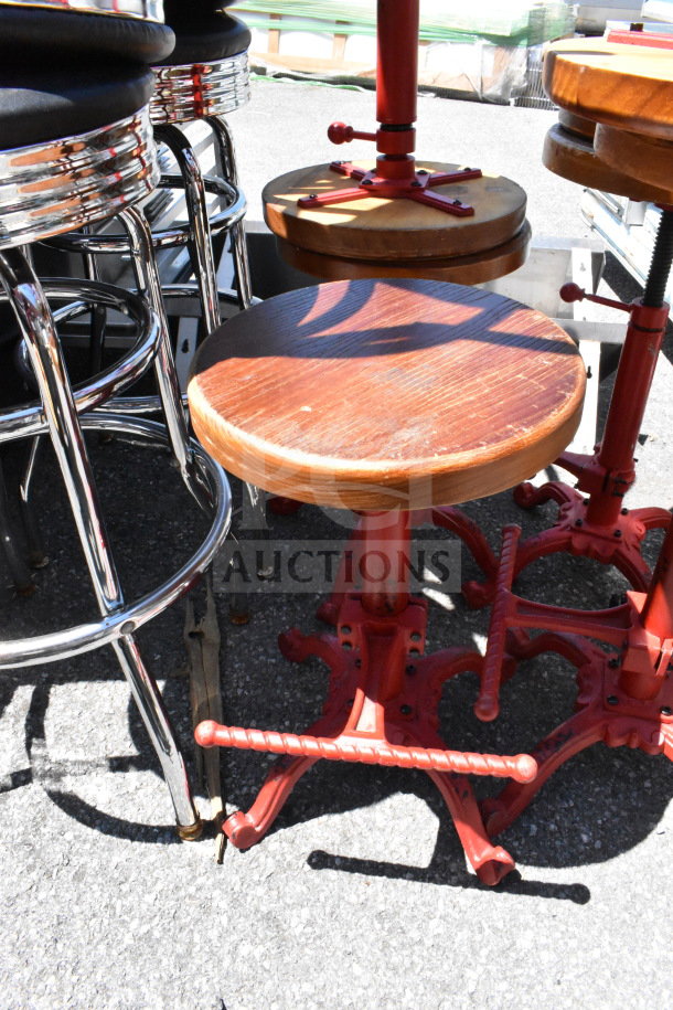 Various stools with metallic and wooden designs, featuring chrome and red metal bases, in used condition, lot of 15.