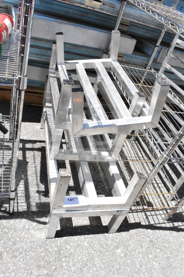 Five metal dunnage racks stacked, in good condition, lot number 141 visible. Auction item: 5 racks at bid times five.