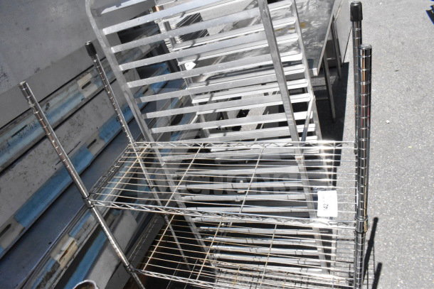 Stainless steel commercial pan rack with multiple shelves. Good condition, ideal for food service use. Item tag reads "42".