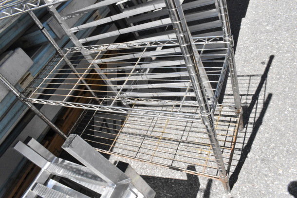 Commercial pan rack, metal wire construction, multiple shelves, good condition, suitable for kitchen storage.