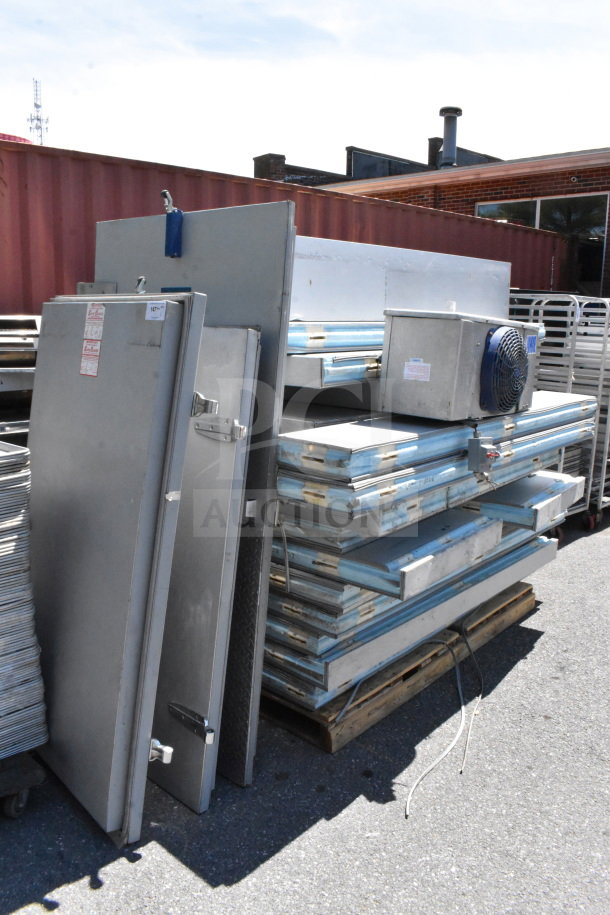 Arctic Walk In Box with Bohn evaporator fan, shown disassembled in good condition, includes doors and panels.