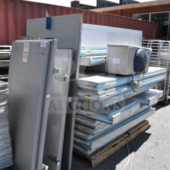 Arctic Walk In Box with Bohn evaporator fan, shown disassembled in good condition, includes doors and panels.