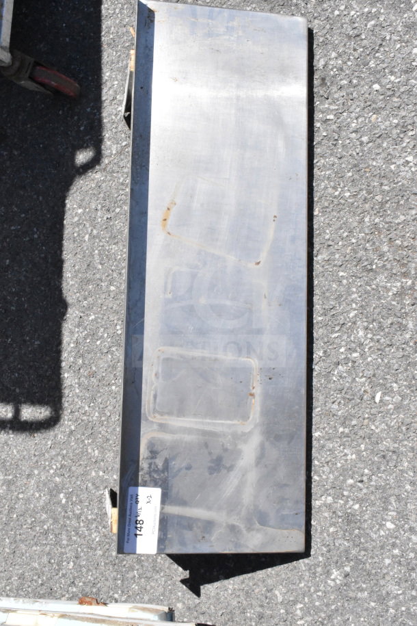 Stainless steel wall mount shelf, rectangular, minor rust spots, includes label '148' indicating item number and bid multiplier.