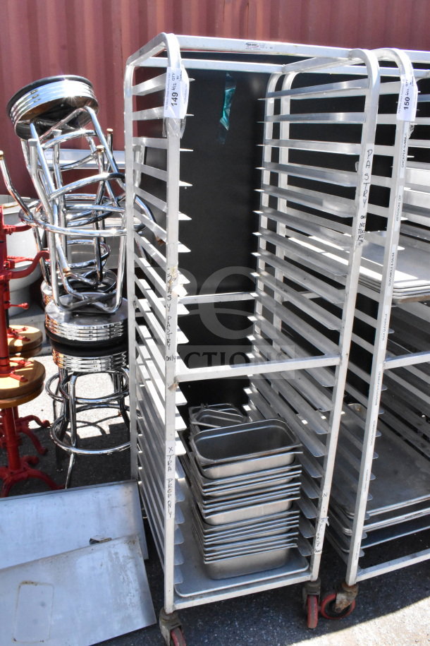 Commercial pan transport rack on casters with 30 drop-in bins. Good condition, labeled for organization.