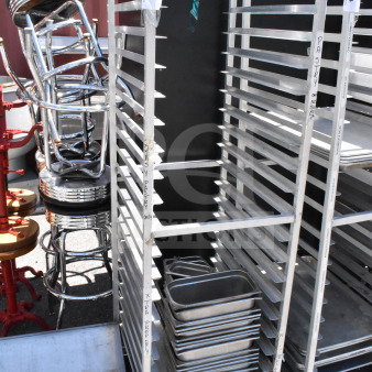 Commercial pan transport rack on casters with 30 drop-in bins. Good condition, labeled for organization.