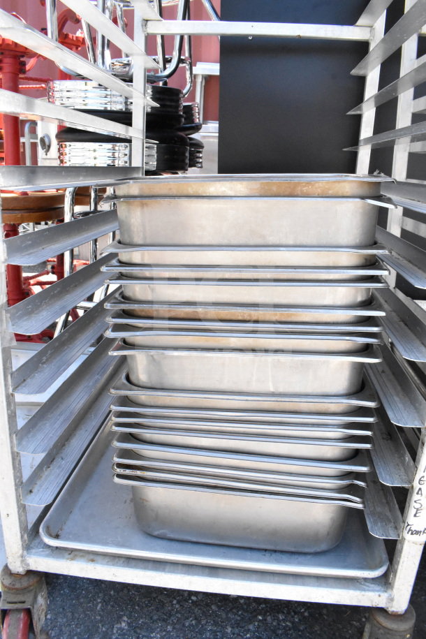 Commercial pan transport rack with 30 drop-in bins, mounted on commercial casters, showing visible metal frame.