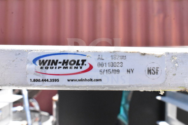 Commercial pan transport rack with 30 drop-in bins on casters, Win-Holt brand, model AL-1820U, NSF certified.