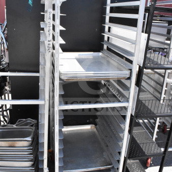 Commercial pan transport rack on casters, includes 10 baking pans, clean condition, labeled for pastry use.