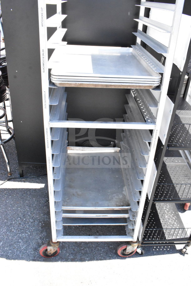 Commercial pan transport rack with 10 baking pans and commercial casters. Labels indicate content sections. Used condition.