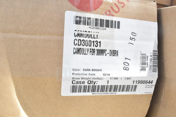 Cardboard box with label showing Camdolly CD300131, dark brown, for 300MPC. Production code: 02/18. Case Qty: 1.