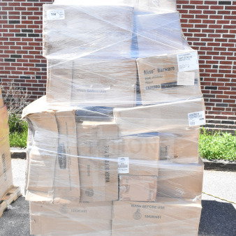 Pallet with 45 scratch and dent items, including platters, glasses, and bins, wrapped in plastic, showing box labels.