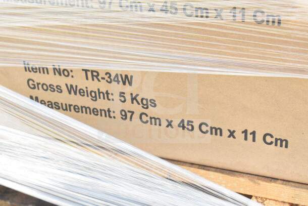 Cardboard box with "Item No: TR-34W", "Gross Weight: 5 Kgs", and "Measurement: 97 Cm x 45 Cm x 11 Cm" marked, wrapped in plastic.