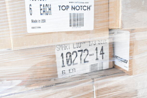 Sealed boxes of Carlisle items, including bowls, tumblers, tongs, and lids, marked "Made in USA" and "Smart Lid."