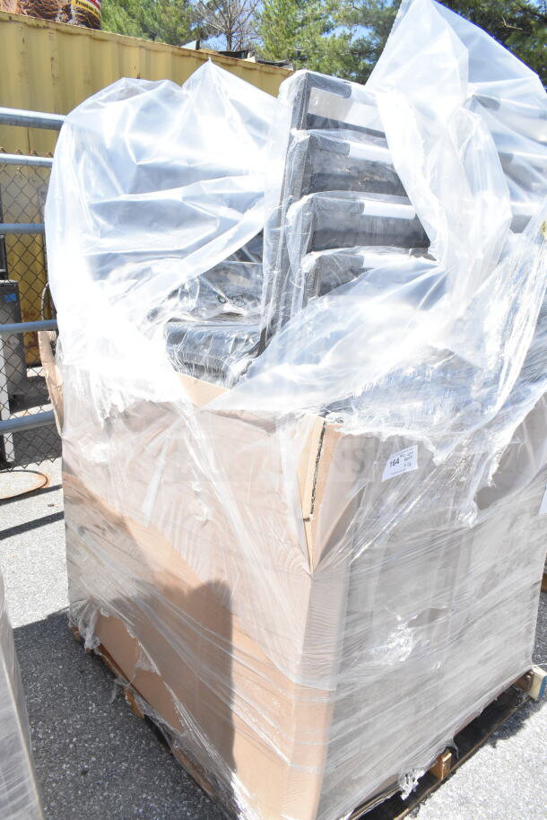 28 new scratch and dent Lancaster Table & Seating banquet chairs wrapped in plastic, black vinyl with silver vein frame.