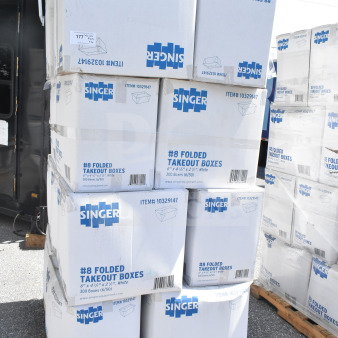 Stack of Singer #8 folded takeout boxes on a pallet, each 6"x4-3/4"x2-1/2", item #10329147, new condition.