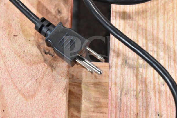 2017 Hobart HTi-7LH26 commercial scale plug detail, 120/208-240V, 1 phase, black power cord on wood surface.