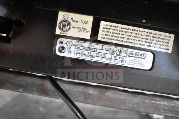 2017 Hobart HTi-7LH26 commercial scale label, showing model, serial number, and specifications. 120/208-240V, 1 phase.