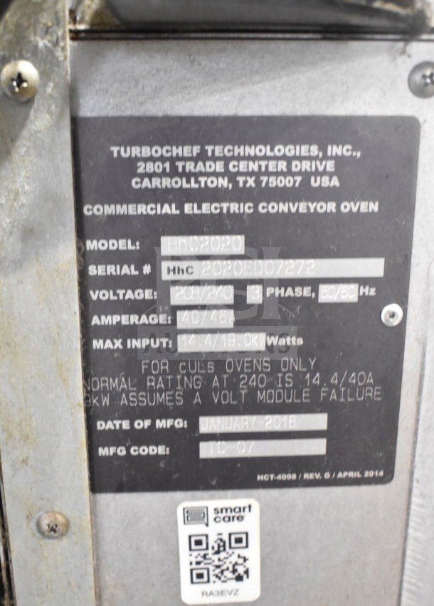 Turbochef HhC2020 electric conveyor oven label showing model, voltage, and specs; includes manufacturing details.