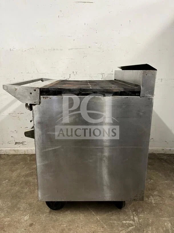 Jade JSR-6-36 heavy-duty 6-burner gas range with oven, stainless steel, used condition, caster wheels, auction item.
