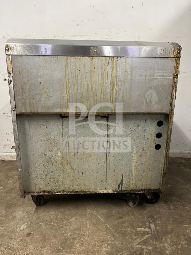 "Supreme" Heavy-Duty Jade JSR-6-36 6-Burner Gas Range with Oven, fair condition, visible wear, on wheels for transport.