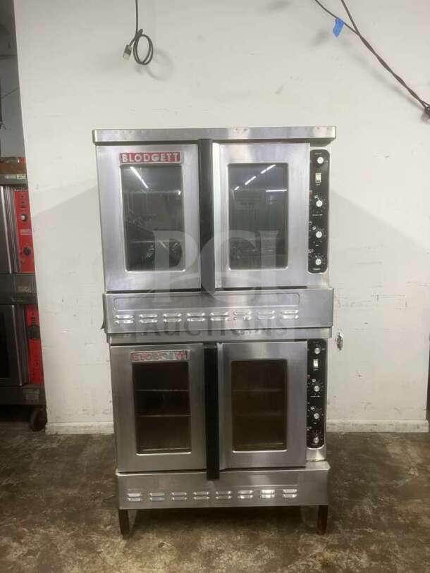 Blodgett stainless steel propane-powered double stack convection oven with solid state thermostat, wired rack, on legs.